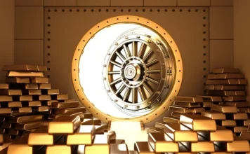 Vàng giữa hai lực kéom cú sốc ngắn hạn và kỳ vọng 8.000 USD trong một chu kỳ tiền tệ mới